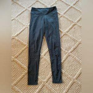 Blue leggings with a mesh bottom. Size small.